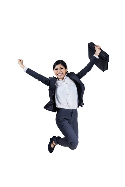 Happy businesswoman jumping with a briefcase — Stock Photo, Image
