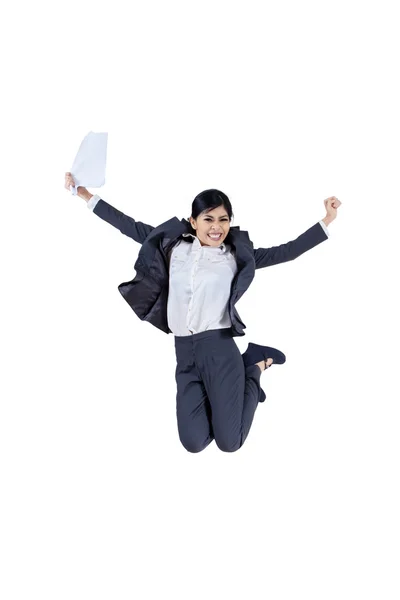 Happy businesswoman jumping with a paper — Stock Photo, Image