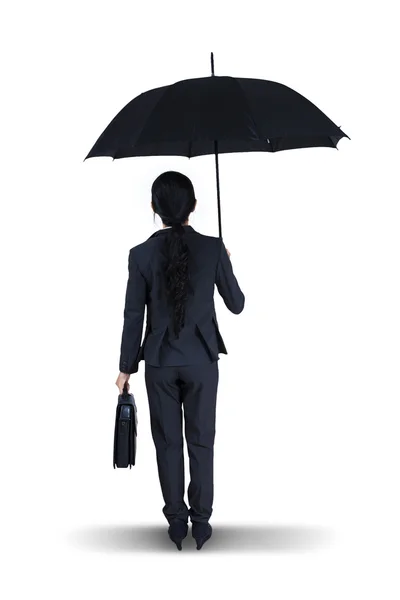 Businesswoman holding an umbrella — Stock Photo, Image