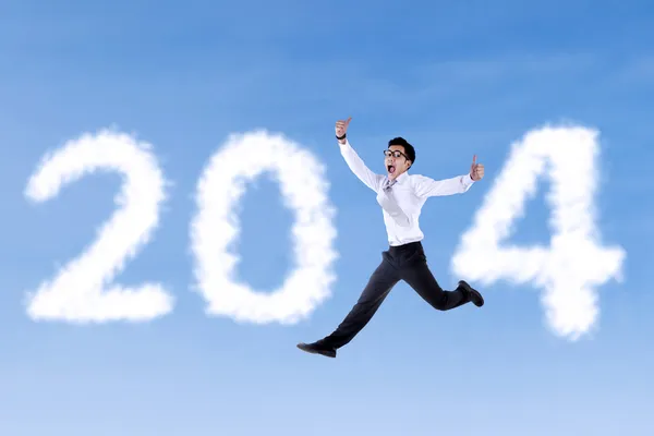 Aufgeregter Geschäftsmann springt mit 2014 — Stockfoto