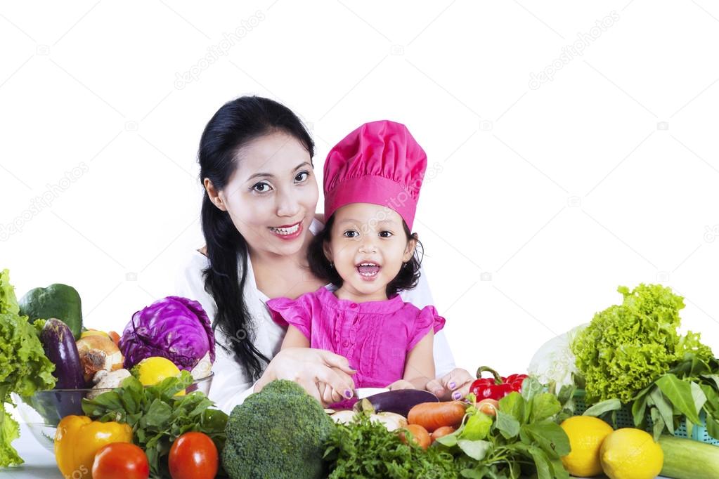 Mother and daughter making a salad