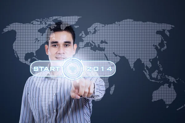 Young man pushing a button — Stock Photo, Image