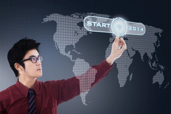 Businessman pressing a virtual button — Stock Photo, Image