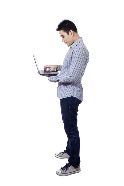 Asian businessman using a laptop — Stock Photo, Image