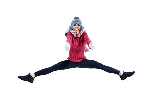 Hübsches Mädchen springt mit erhobenen Daumen — Stockfoto