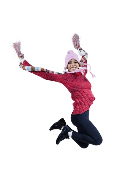 Woman in winter clothing jumping — Stock Photo, Image