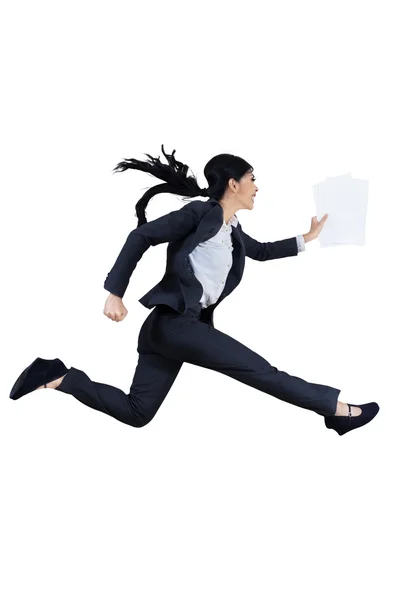 Businesswoman runs by holding business paper — Stock Photo, Image