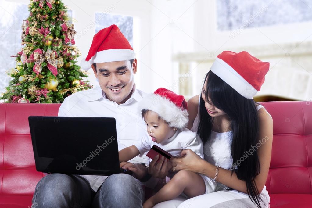 Christmas family using laptop