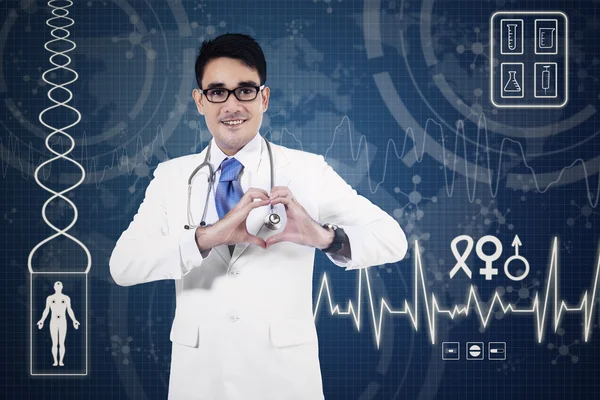 Medical doctor showing heart sign — Stock Photo, Image