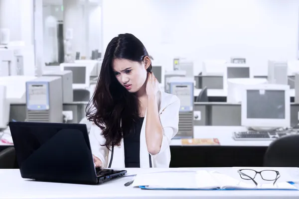 Tired businesswoman in office — Stock Photo, Image