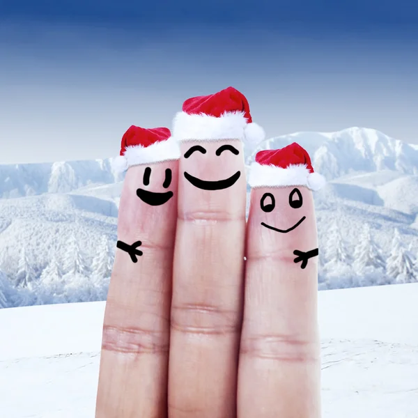 Finger klädd i jultomten hattar — Stockfoto