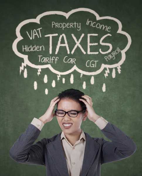 Stressed businesswoman for paying her taxes — Stock Photo, Image