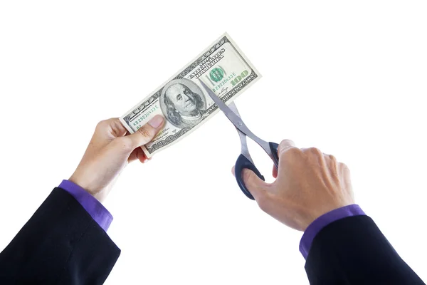 Hands with scissors cutting money — Stock Photo, Image