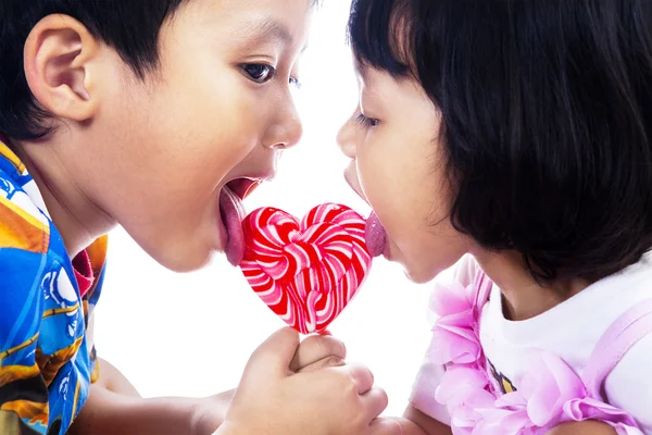 Two children with lollipop — Stock Photo, Image