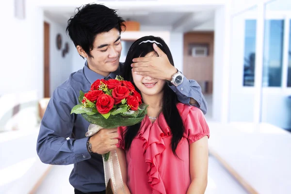Romantic couple with flowers — Stock Photo, Image