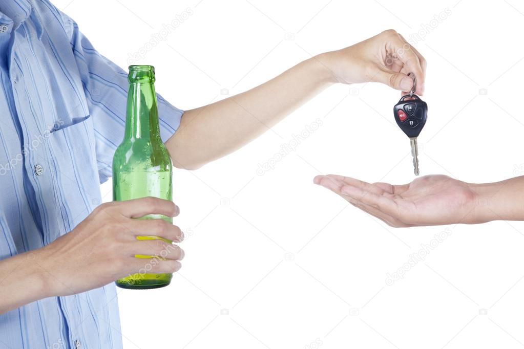 Alcoholic giving a car key to someone