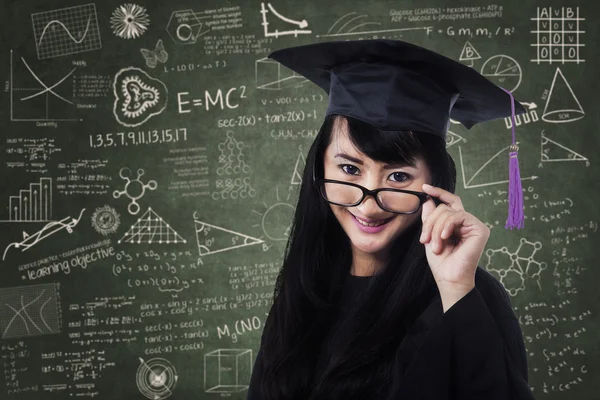 Female student in an academic gown — Stock Photo, Image