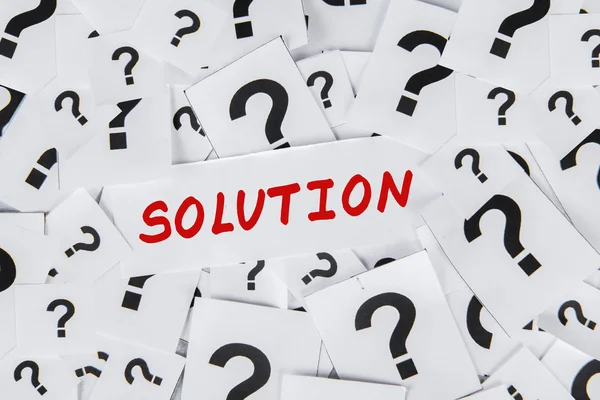 Solution and question marks — Stock Photo, Image
