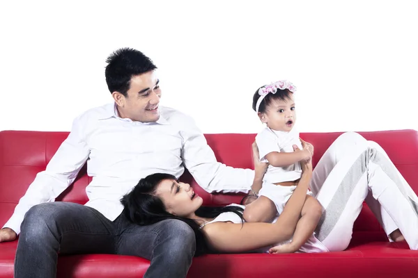 Happy asian family playing on sofa — Stock Photo, Image