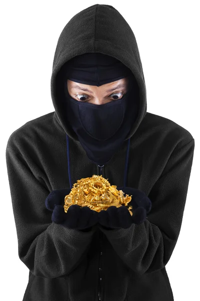 A thief holding stolen gold — Stock Photo, Image