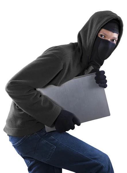 Thief stealing a laptop computer — Stock Photo, Image