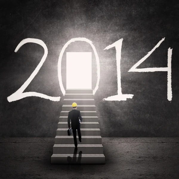 Businessman walking into opportunity door — Stock Photo, Image