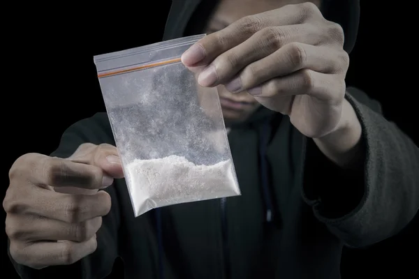 Man with packet of cocaine — Stock Photo, Image