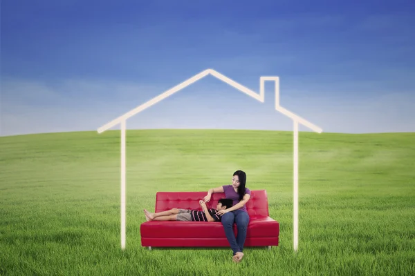 Mother and son in dream house outdoor — Stock Photo, Image