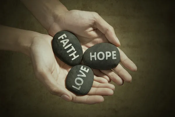 Hands holding stones — Stock Photo, Image