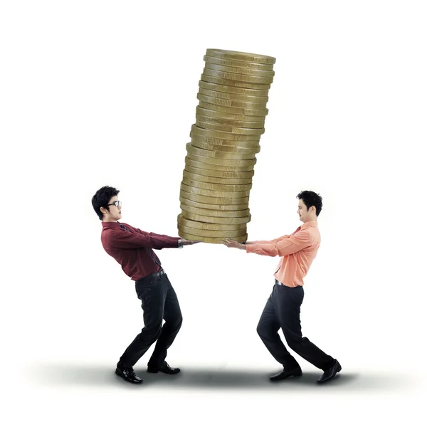 Businessmen carrying golden coins — Stock Photo, Image
