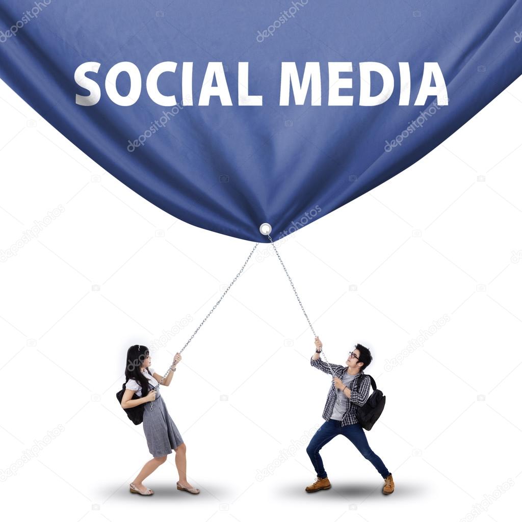 Students pulling social media banner