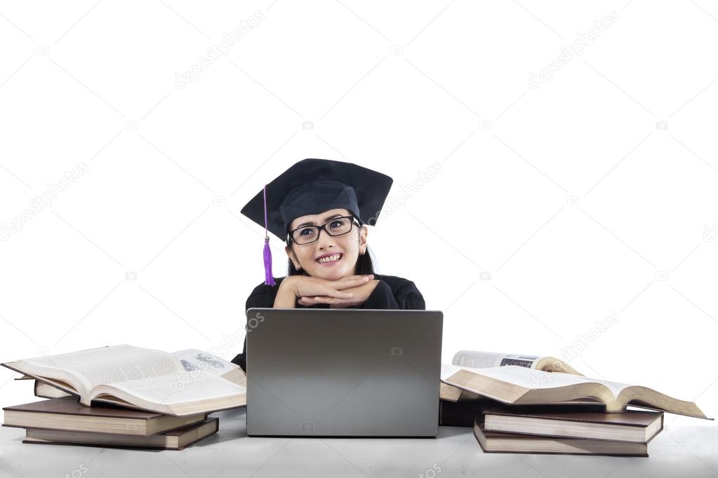 Thoughtful bachelor in graduation cap