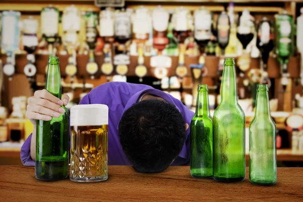 Alcoholic sleeping in the bar — Stock Photo, Image