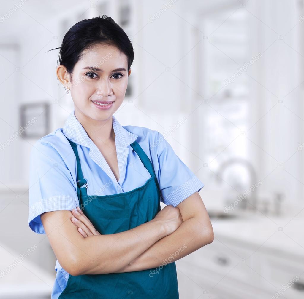 Confident female housekeeper