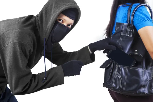 Thief stealing cell phone — Stock Photo, Image