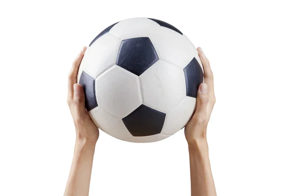 Mãos segurando bola de futebol — Fotografia de Stock