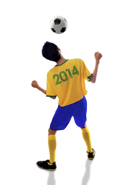 Soccer player heading ball isolated — Stock Photo, Image