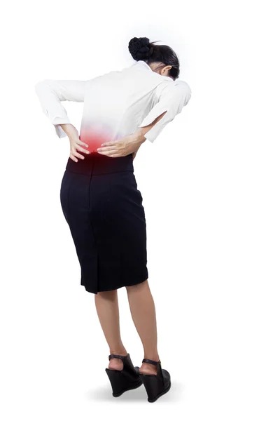 Young businesswoman having back pain — Stock Photo, Image