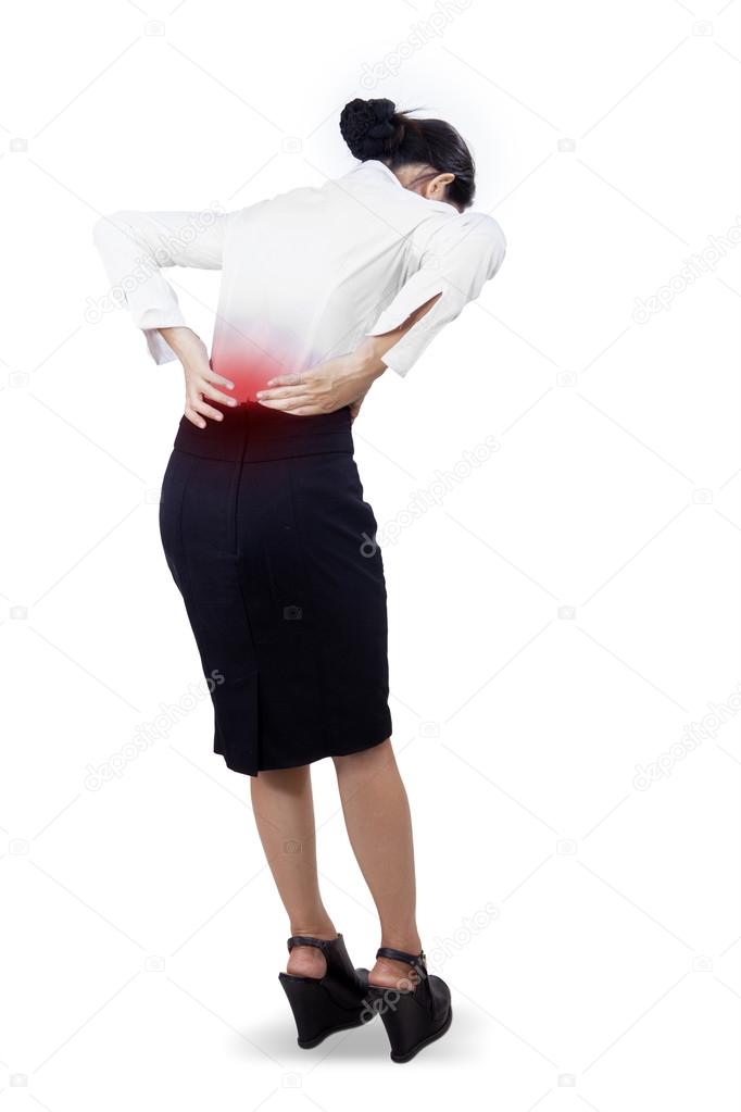 Young businesswoman having back pain