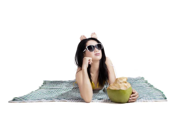 Woman in bikini lying on mat isolated — Stock Photo, Image