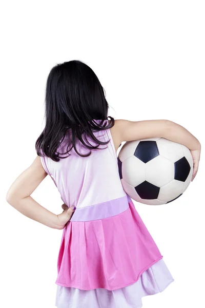 Back view of little girl holding a ball — Stock Photo, Image