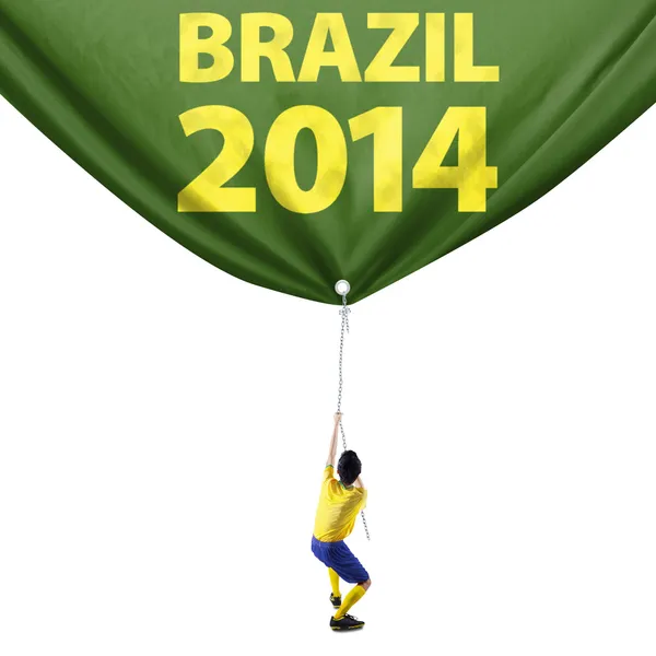 Футболист тянет знамя чемпионата 1 — стоковое фото