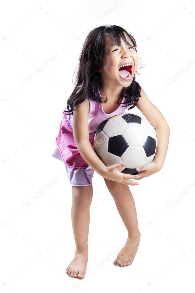 Cute girl play soccer ball isolated