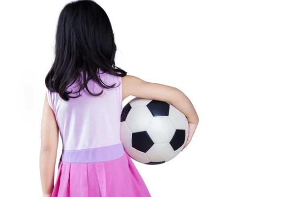 Back side of little girl holding a ball — Stock Photo, Image