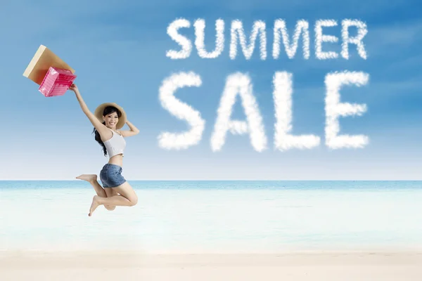 Summer sale clouds and woman — Stock Photo, Image