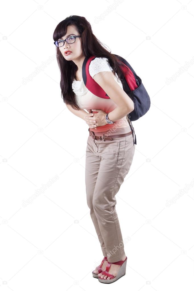 Female student having abdominal pain