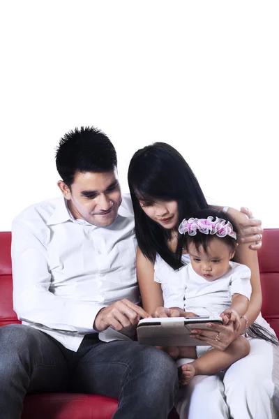 Happy family using a digital tablet — Stock Photo, Image