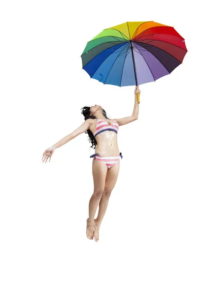 Attraente donna in bikini jumping — Foto Stock