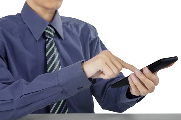 Affärsman med en mobiltelefon — Stockfoto