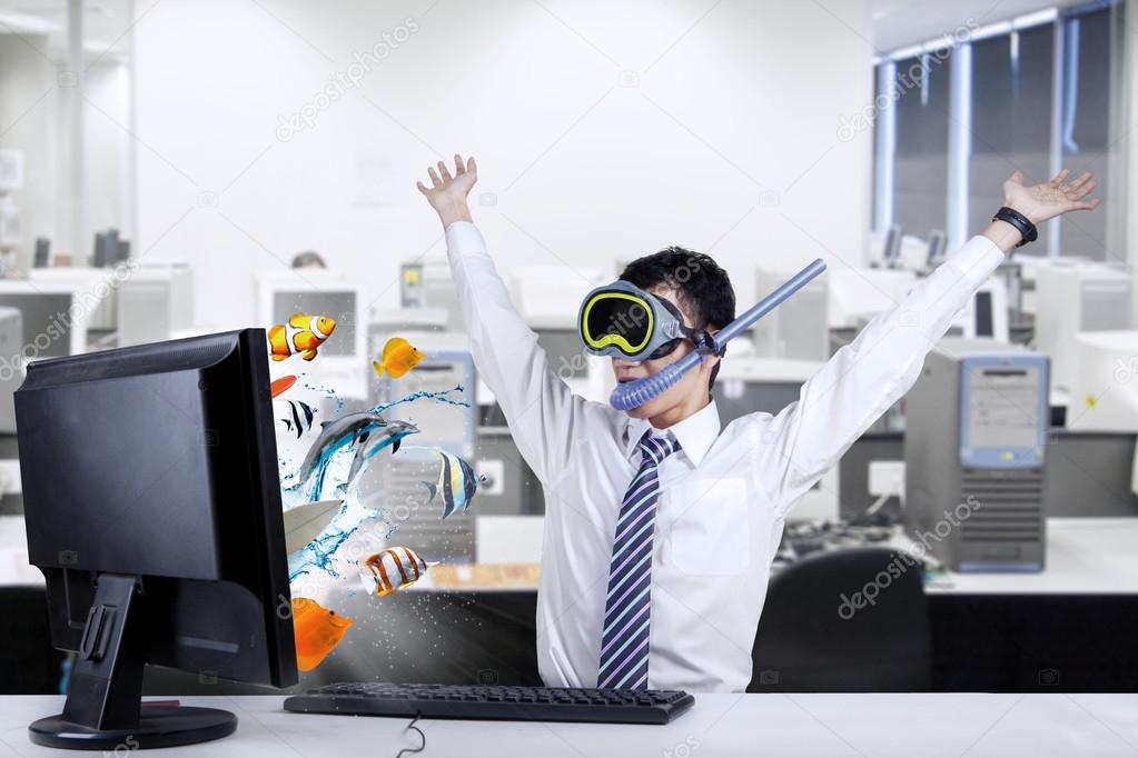 Shocked businessman with snorkeling mask at office